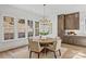 Bright dining area with custom cabinets and a round wood table at 5022 Ohm Ln, Charlotte, NC 28270