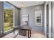 Comfortable home office featuring natural light and serene views of the outdoors at 5022 Ohm Ln, Charlotte, NC 28270