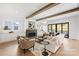 Bright living room featuring hardwood floors, a fireplace, and exposed beams at 5022 Ohm Ln, Charlotte, NC 28270