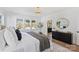 Main bedroom featuring hardwood floors, a decorative light fixture and a large window at 5022 Ohm Ln, Charlotte, NC 28270