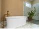 Elegant bathroom featuring a freestanding tub and marble shower at 5523 Closeburn Rd, Charlotte, NC 28210