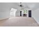 Spacious bedroom with carpeted floor, ceiling fan, and built-in desk at 5523 Closeburn Rd, Charlotte, NC 28210