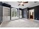 Well-lit bedroom with built-in shelves and window seat at 5523 Closeburn Rd, Charlotte, NC 28210