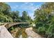 Community with a scenic walking trail alongside a creek at 5523 Closeburn Rd, Charlotte, NC 28210