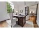 Spacious home office with built-in desk and large window overlooking backyard at 5523 Closeburn Rd, Charlotte, NC 28210