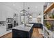 Elegant kitchen with large island, marble countertops and breakfast bar at 5523 Closeburn Rd, Charlotte, NC 28210