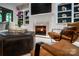 Cozy living room with fireplace, built-in shelving, and comfortable seating at 5523 Closeburn Rd, Charlotte, NC 28210