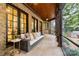 Relaxing screened porch with stone floor and comfortable seating at 5523 Closeburn Rd, Charlotte, NC 28210