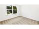 Well-lit bedroom featuring a large window and neutral decor at 734 Cantwell St, Charlotte, NC 28208