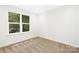 Bright bedroom with large window and neutral carpet at 734 Cantwell St, Charlotte, NC 28208