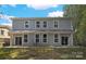 Rear view of duplex showing a patio and backyard at 734 Cantwell St, Charlotte, NC 28208