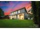 Evening view of duplex showcasing backyard and landscaping at 734 Cantwell St, Charlotte, NC 28208