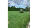 Lush backyard with expansive lawn and mature trees at 139 Sain Rd, Statesville, NC 28625