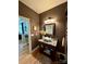 Bathroom featuring neutral paint, a unique granite sink, and decorative lighting fixtures at 152 Bridge Pointe Ln, Hickory, NC 28601