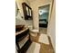 Bathroom features a bowl sink on a granite countertop with cabinets and decorative towels at 152 Bridge Pointe Ln, Hickory, NC 28601