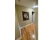 Hallway has wood floors with a large art piece hanging on the wall at 152 Bridge Pointe Ln, Hickory, NC 28601