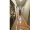 Hallway has hardwood floors and leads to an upstairs staircase at 152 Bridge Pointe Ln, Hickory, NC 28601