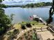 A stunning lake view from the property featuring a boat dock, lush greenery, and scenic views at 152 Bridge Pointe Ln, Hickory, NC 28601