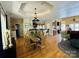 Open-concept living and dining area with hardwood floors and a decorative chandelier at 152 Bridge Pointe Ln, Hickory, NC 28601