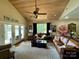 Inviting living room features a wood ceiling, fan, and access to the lake view at 152 Bridge Pointe Ln, Hickory, NC 28601