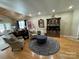 Living room features wood floors, wooden ceiling, wooden hutch, and matching sitting chairs at 152 Bridge Pointe Ln, Hickory, NC 28601