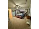 Carpeted primary bedroom features a ceiling fan and two side tables with decorative lamps at 152 Bridge Pointe Ln, Hickory, NC 28601