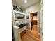 Small office featuring a white bookcase with a black desk that leads to a small bathroom with a view at 152 Bridge Pointe Ln, Hickory, NC 28601