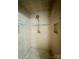 Close-up of shower featuring updated tile work and fixtures at 152 Bridge Pointe Ln, Hickory, NC 28601