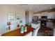 Bright dining area adjacent to kitchen, featuring a wood table and chairs at 133 Woodhall Way, Troutman, NC 28166