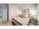 Comfortable bedroom with a patterned bedspread, neutral walls, and bedside tables at 133 Sari St, Troutman, NC 28166