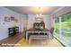 Elegant dining room with a modern table, chairs, bench, and outdoor views at 133 Sari St, Troutman, NC 28166