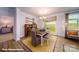 Stylish dining room with wood floors, decorative accents, and abundant natural light at 133 Sari St, Troutman, NC 28166