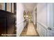 Welcoming hallway with hardwood floors, wainscoting, and an elegant console table at 133 Sari St, Troutman, NC 28166