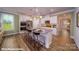 Modern kitchen with white cabinets, granite countertops, and stainless steel appliances at 133 Sari St, Troutman, NC 28166