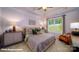 Comfortable main bedroom with tray ceiling, large window, bedside lamps, and elegant furnishings at 133 Sari St, Troutman, NC 28166