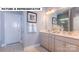 Elegant bathroom with double vanity, stylish fixtures, and a glass-enclosed shower at 145 Sari St, Troutman, NC 28166