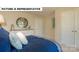 Bedroom featuring a comfortable queen bed, soft carpet, and neutral decor for relaxation at 145 Sari St, Troutman, NC 28166