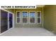 Covered patio with bright natural light and a view through large windows at 145 Sari St, Troutman, NC 28166