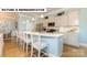 Bright kitchen with stainless steel appliances, island seating, and modern finishes at 145 Sari St, Troutman, NC 28166