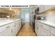 Modern kitchen featuring white cabinetry, stainless steel appliances, and a spacious countertop at 145 Sari St, Troutman, NC 28166