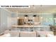 Open-concept kitchen and living room featuring a large island with seating and stainless steel appliances at 145 Sari St, Troutman, NC 28166