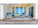 Relaxing patio featuring comfortable seating, a coffee table, and a view of the backyard at 145 Sari St, Troutman, NC 28166