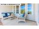 Charming patio with wicker furniture, decorative pillows, and an inviting outdoor space at 145 Sari St, Troutman, NC 28166