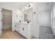 Spacious bathroom featuring double sinks, a large mirror, and an additional room with a tub at 2140 Indigo Branch Rd, Indian Land, SC 29707