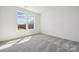 Bedroom features carpeted floors and windows with backyard views at 2140 Indigo Branch Rd, Indian Land, SC 29707