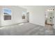 Well-lit bedroom with two windows and ensuite bathroom access at 2140 Indigo Branch Rd, Indian Land, SC 29707