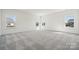 Spacious bedroom with three windows offering plenty of natural light and views of the neighborhood at 2140 Indigo Branch Rd, Indian Land, SC 29707