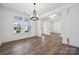 Dining room with hardwood floors, ample natural light, and traditional chandelier at 2140 Indigo Branch Rd, Indian Land, SC 29707