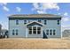 Back exterior featuring a blue siding and many windows for natural light at 2140 Indigo Branch Rd, Indian Land, SC 29707