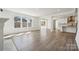 Bright open-concept living room with hardwood floors, lots of natural light, and an open design at 2140 Indigo Branch Rd, Indian Land, SC 29707